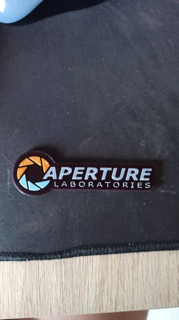 Móc Khóa Aperture Laboratories - 4 Màu - Image 1