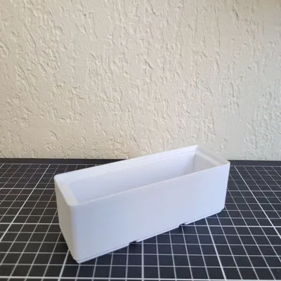 Hộp Gridfinity cho máy in nhãn Niimbot D110