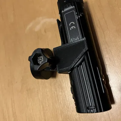 Pat Gắn Đèn Pin Fenix BC26R Cho Đế Garmin