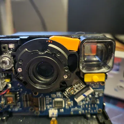 Sửa Ống Kính Máy Ảnh Polaroid One Step 2 Bị Hỏng