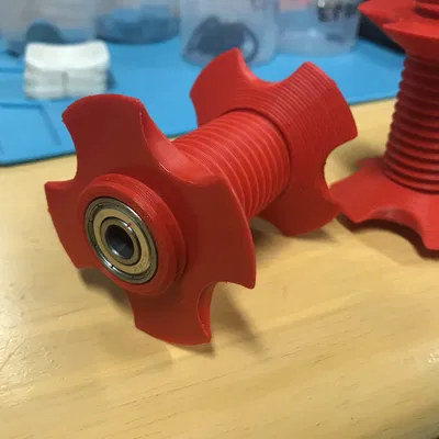 Trục cuộn dây tóc trung tâm có bạc đạn