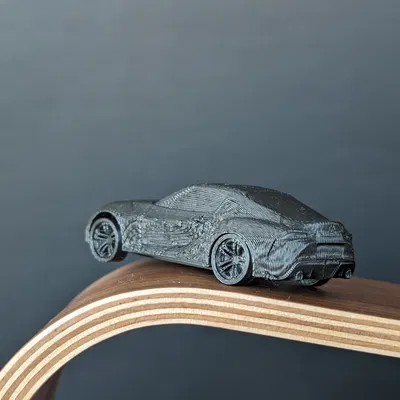 Mô Hình Toyota Supra A90 In Liền Kèm Bánh Xe Quay