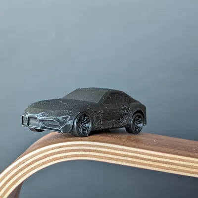 Mô Hình Toyota Supra A90 In Liền Kèm Bánh Xe Quay