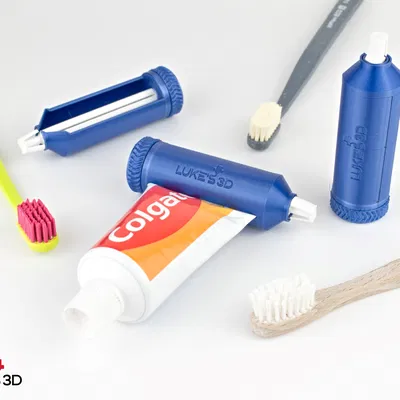 Dụng cụ bóp tuýp kem đánh răng dạng bánh răng