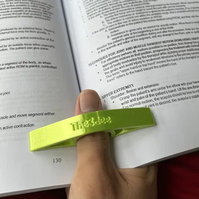 Dụng cụ giữ trang sách bằng ngón tay cái