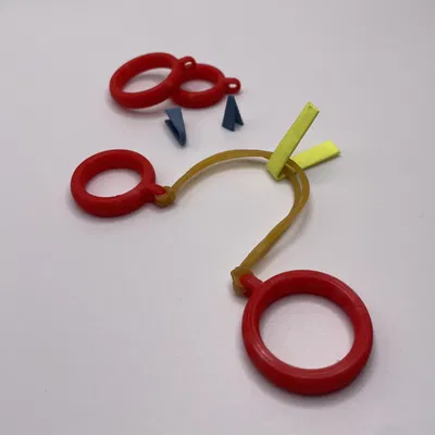 Fingerzwille - Đồ chơi bắn dây thun thời đi học