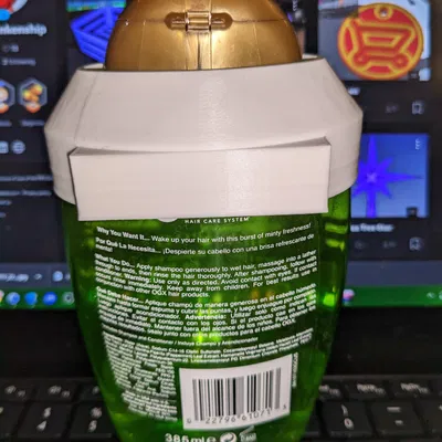 Người giữ dầu gội bạc Ogx Teatree Mint