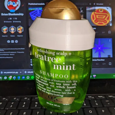 Người giữ dầu gội bạc Ogx Teatree Mint