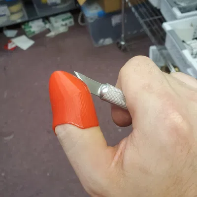 Chụp ngón tay cái Xacto