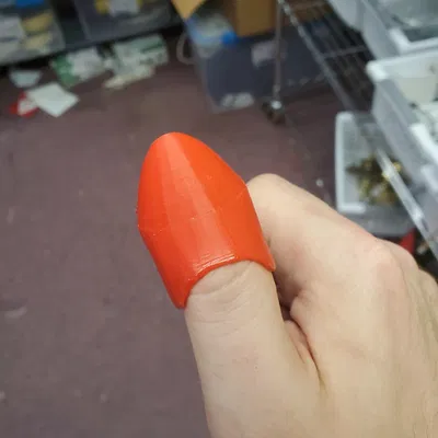 Chụp ngón tay cái Xacto