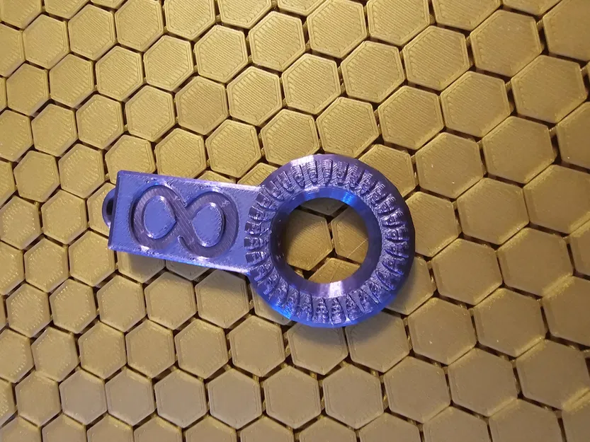 Móc khóa tròn có hoa văn - Image 1