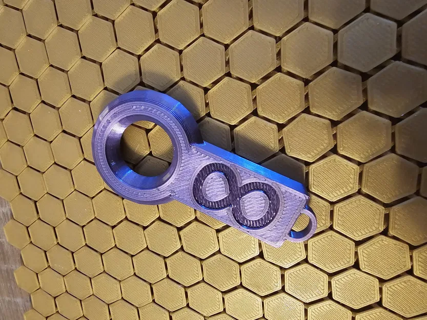 Móc khóa tròn có hoa văn - Image 2