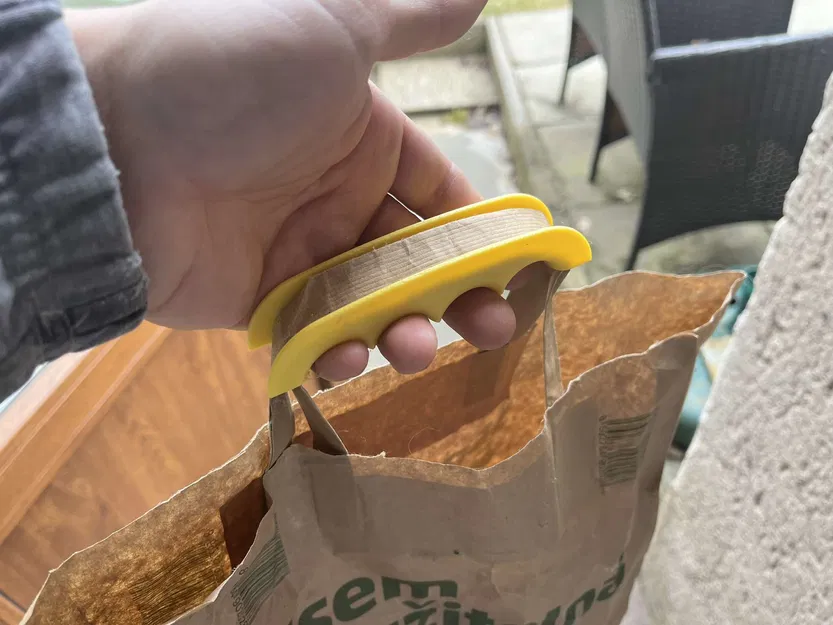 Kẹp túi nilon đi chợ, mang được nhiều thứ cùng lúc - Image 1