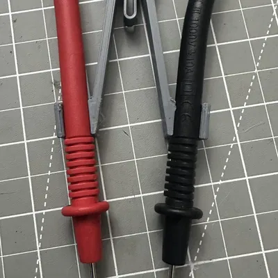 Nhíp giữ que đo multimeter