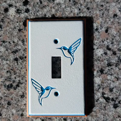 Tấm ốp công tắc đèn hình chim ruồi