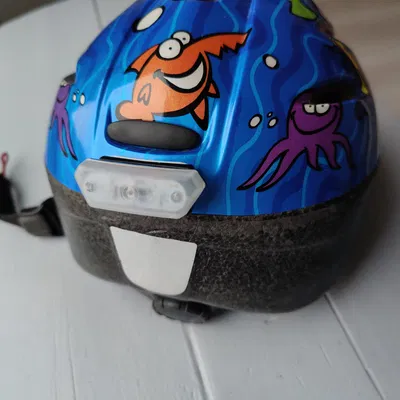 Giá đỡ đèn LED ABUS Smiley 3.0 cho nón bảo hiểm trẻ em