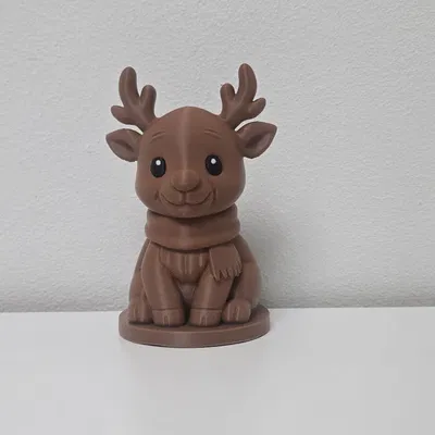 Tượng Tuần Lộc Ngồi Quàng Khăn Ấm Áp Mùa Giáng Sinh