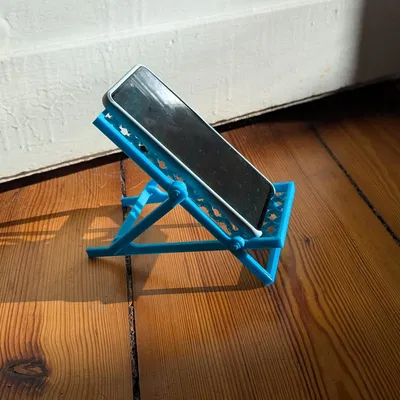 Giá đỡ điện thoại hình ghế xếp bãi biển