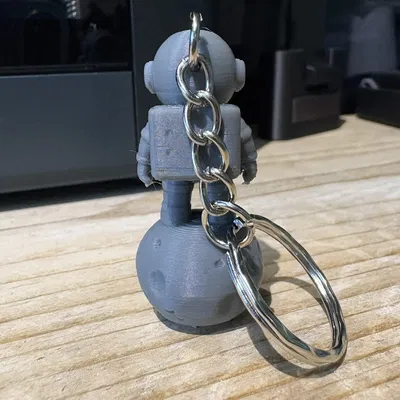 Móc Khóa Spaceman Dễ Thương Trên Tảng Đá