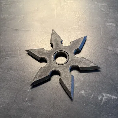 Con Quay Fidget Hình Phi Tiêu Có Vòng Bi