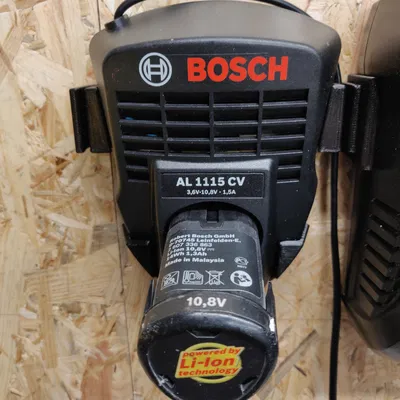 Giá Đỡ Treo Tường Sạc Pin Bosch AL 1115 CV