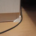 Miếng bảo vệ cáp ở góc tủ (Cabinet corner cable protector) - Thumbnail 1