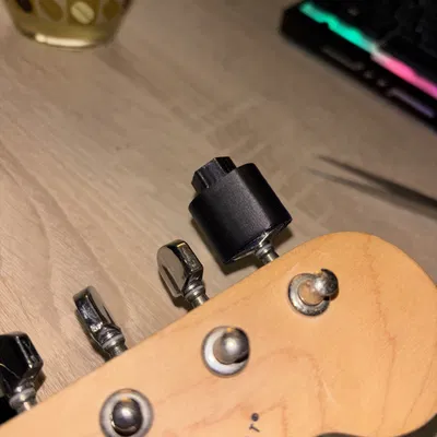 Dụng cụ kéo dây đàn guitar (Guitar string puller)