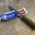Dao đồ chơi KA-BAR kiêm dụng cụ bóp kem đánh răng (toothpaste squeezer/squeegee) - Thumbnail 1