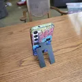 Chân đỡ điện thoại bật ra (Pop-out cellphone stand) - Thumbnail 1