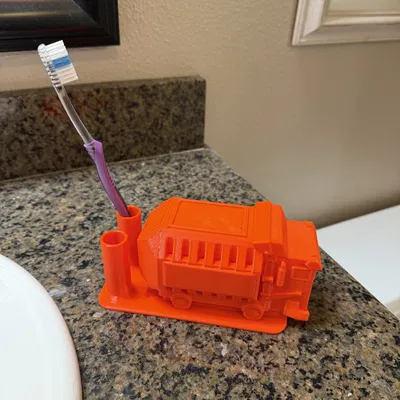 Giá/khay bàn chải hình xe rác (Trash Truck) – bản remix