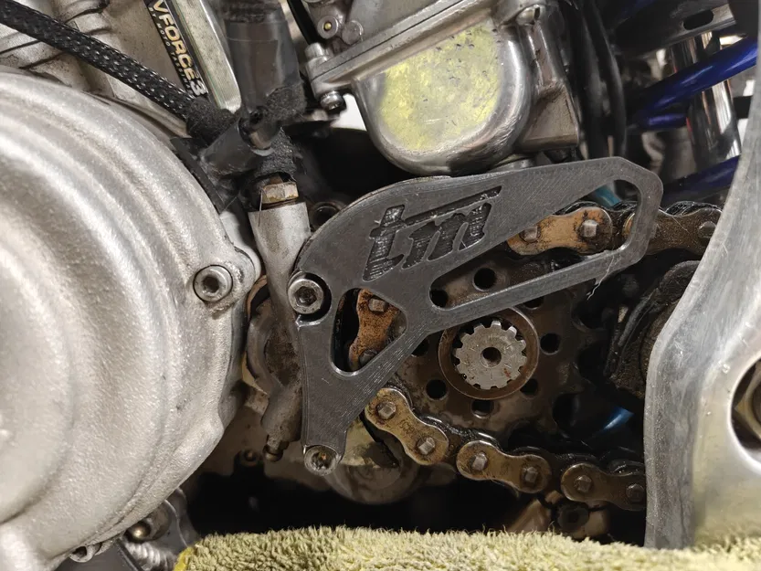 Miếng bảo vệ nhông trước TM Racing (Front Sprocket Protector) - Image 1