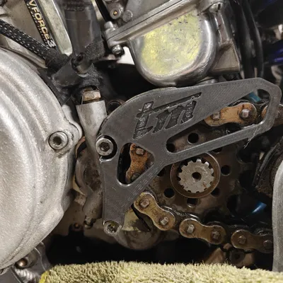 Miếng bảo vệ nhông trước TM Racing (Front Sprocket Protector)