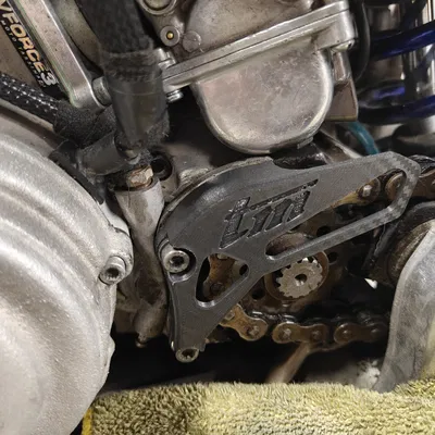 Miếng bảo vệ nhông trước TM Racing (Front Sprocket Protector)