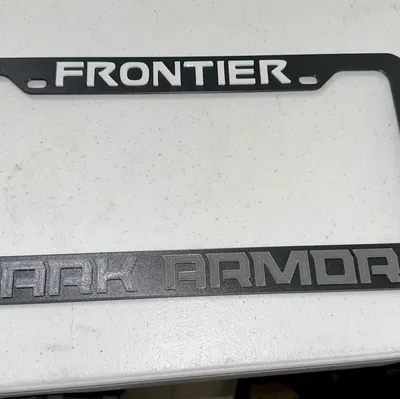 Ốp che biển số Nissan Frontier Dark Armor