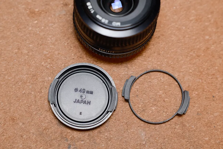 Miếng bóp thay thế nắp ống kính Minolta 49mm (Squeezy Bit) - Image 1