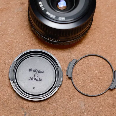Miếng bóp thay thế nắp ống kính Minolta 49mm (Squeezy Bit)