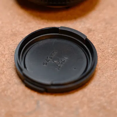 Miếng bóp thay thế nắp ống kính Minolta 49mm (Squeezy Bit)