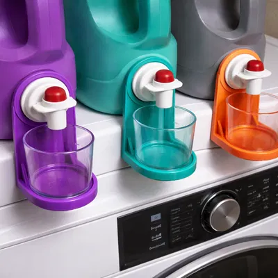 Cốc đong bột giặt và giá đỡ cốc