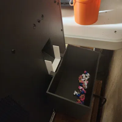 Bộ gá và hộp Poop Chute