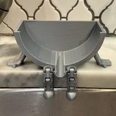 Giá để Scrub Daddy gác bồn rửa dạng khớp, có lỗ thoát nước