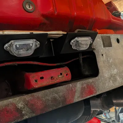 Giá đỡ đèn biển số sau RX7 FD3S (FD01-51-261A)