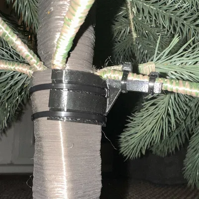 Giá đỡ nhánh cây thông Noel bị gãy