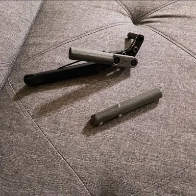 Ngàm gắn liên kết phanh xe lăn Newton (Newton Wheelchair Brake Linkage Mount)