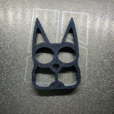 Móc khóa Cat Eyes dạng two-finger brass knuckles
