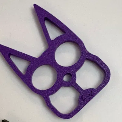 Móc khóa Cat Eyes dạng two-finger brass knuckles