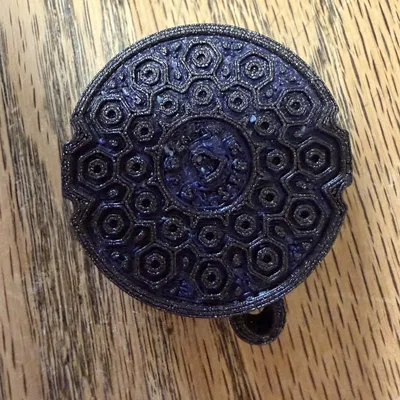 Móc khóa giữ AirTag kiểu nắp hố ga Bell System