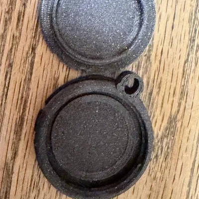 Móc khóa giữ AirTag kiểu nắp hố ga Bell System