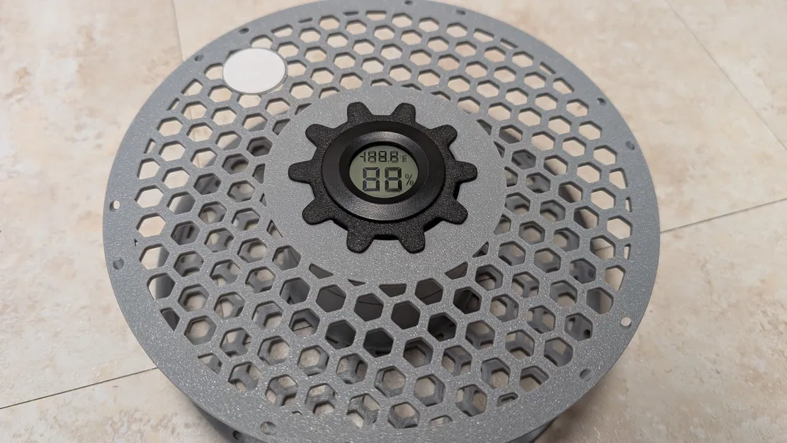 Giá đỡ desiccant gắn giữa lỗ trung tâm của cuộn spool - Image 1