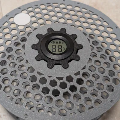 Giá đỡ desiccant gắn giữa lỗ trung tâm của cuộn spool