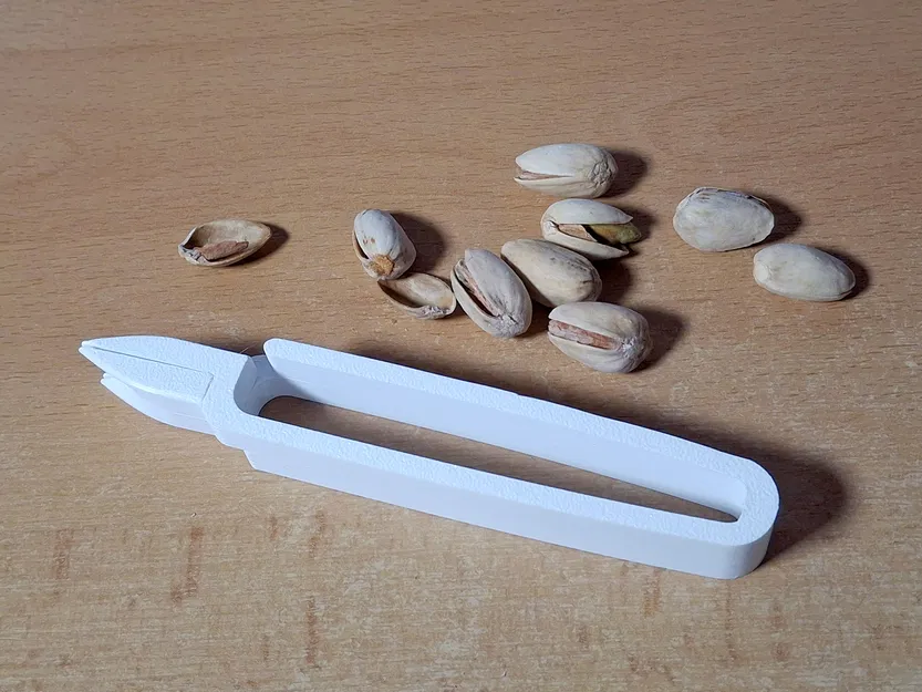 Pistachionator - Dụng cụ mở hạt dẻ cười (pistachio opener) - Image 1